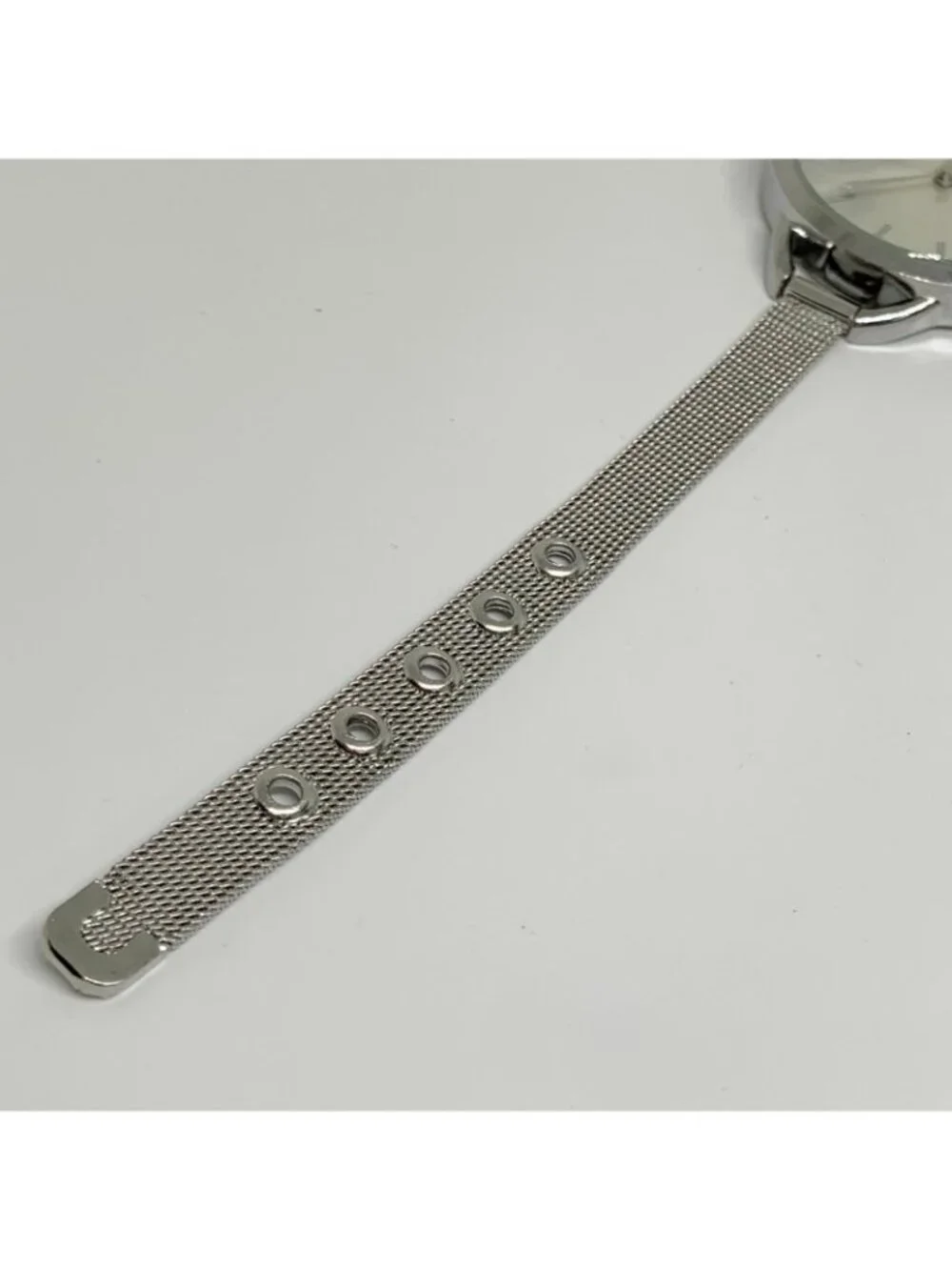 Silver tone women’s quartz analog watch 38mm adjustable mesh band running
